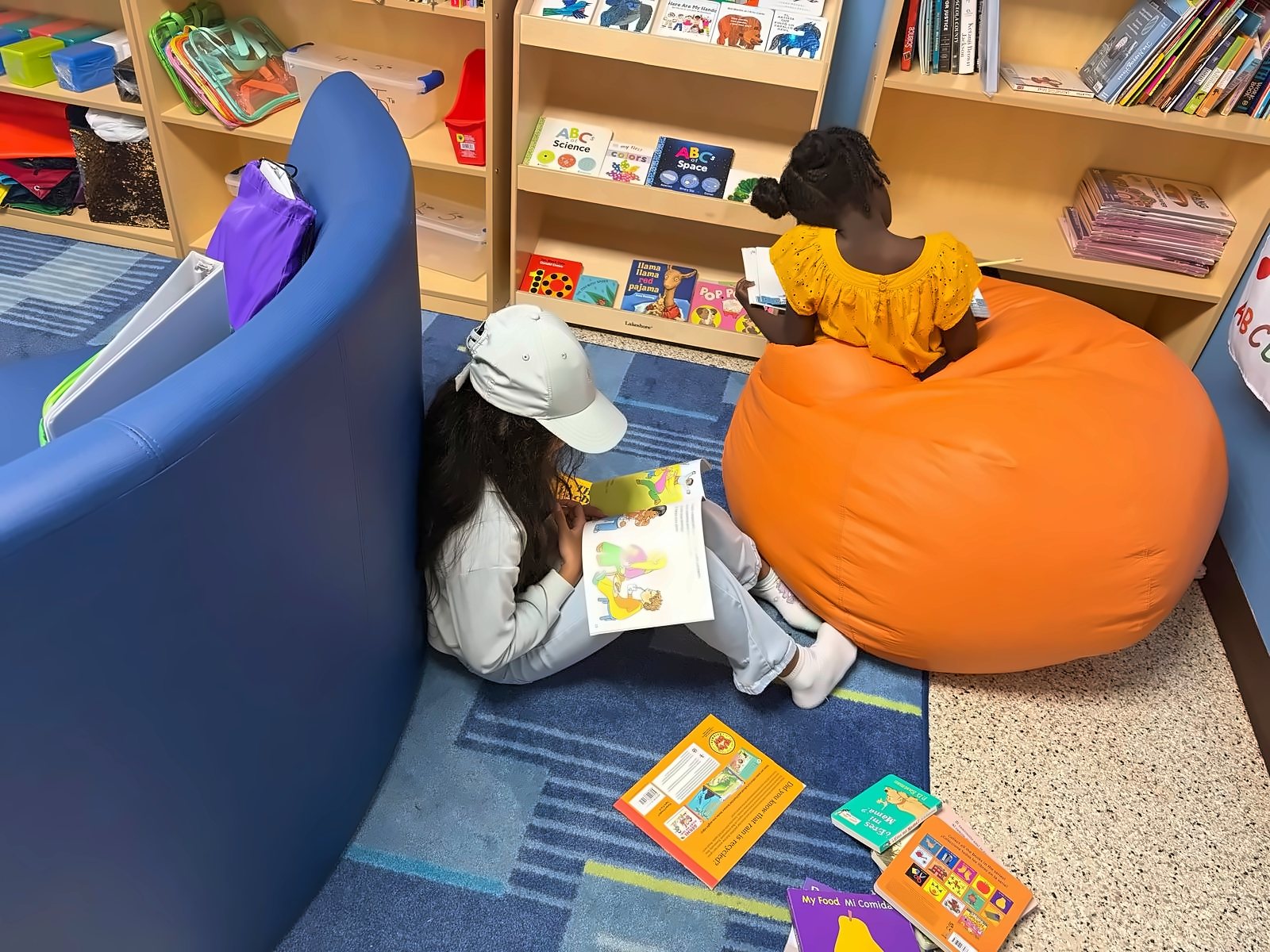 SWREA students reading on beanbags in the reading corner